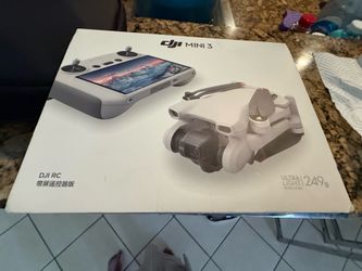 DJI mini 3 with  RC remote and 2 micro sd cards and Drone back pack