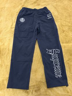 Supreme Black Track Pants with Gothic Lettering