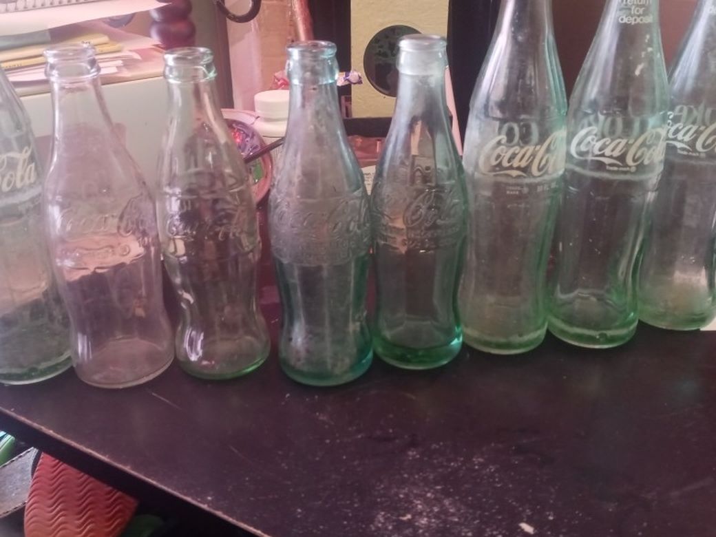 8 Coca Cola Vintage Bottles