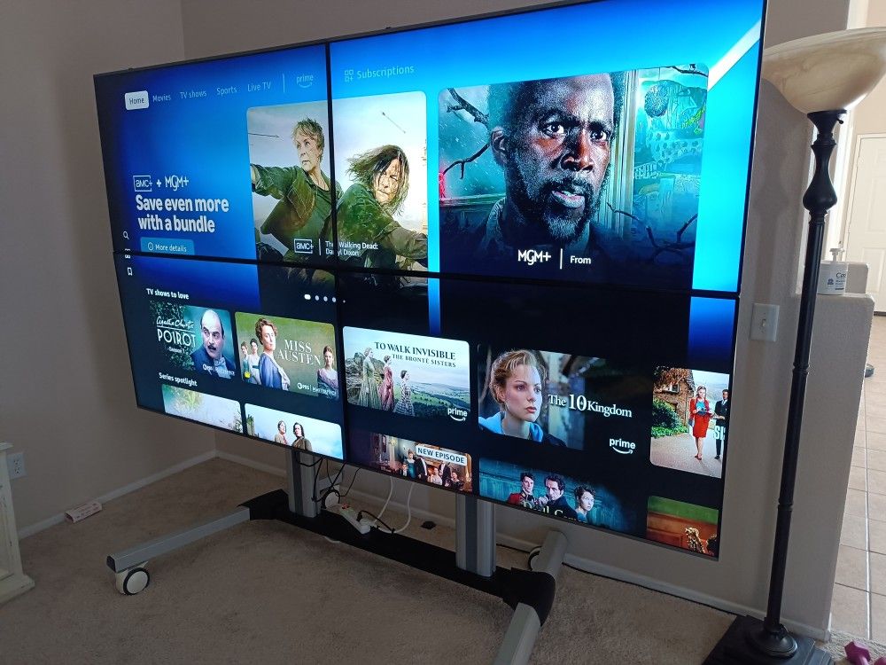 Video Wall Bundle with (4) SAMSUNG TVs with rolling stand & screen split controller, 111 inches total diagonal length

Condition is used for a few eve