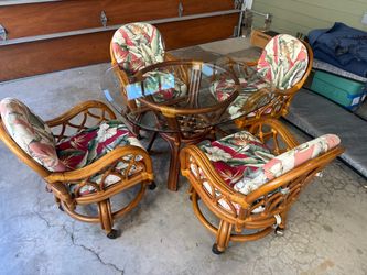 Mid century rattan  kitchen /dining room table and chairs, chairs are swivel with casters 42 in glass top good shape