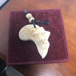 CARVED AFRICAN PENDANT 