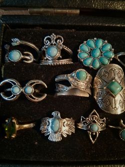20 faux turquoise rings sold as a group