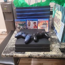 Ps4 Pro With A Couple Of Games And 2 Controllers