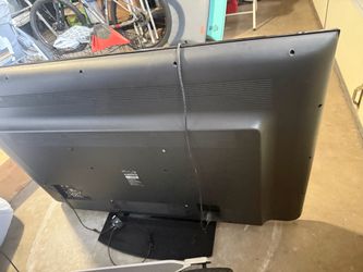 65-inch Sharp AQUOS flat-screen TV.
