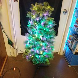 Cashmere Xtree Prelit With White Lights And Strung With Pink And Green Led Lights.