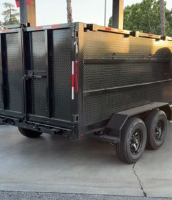 Scissor lift hydraulic dump trailer
