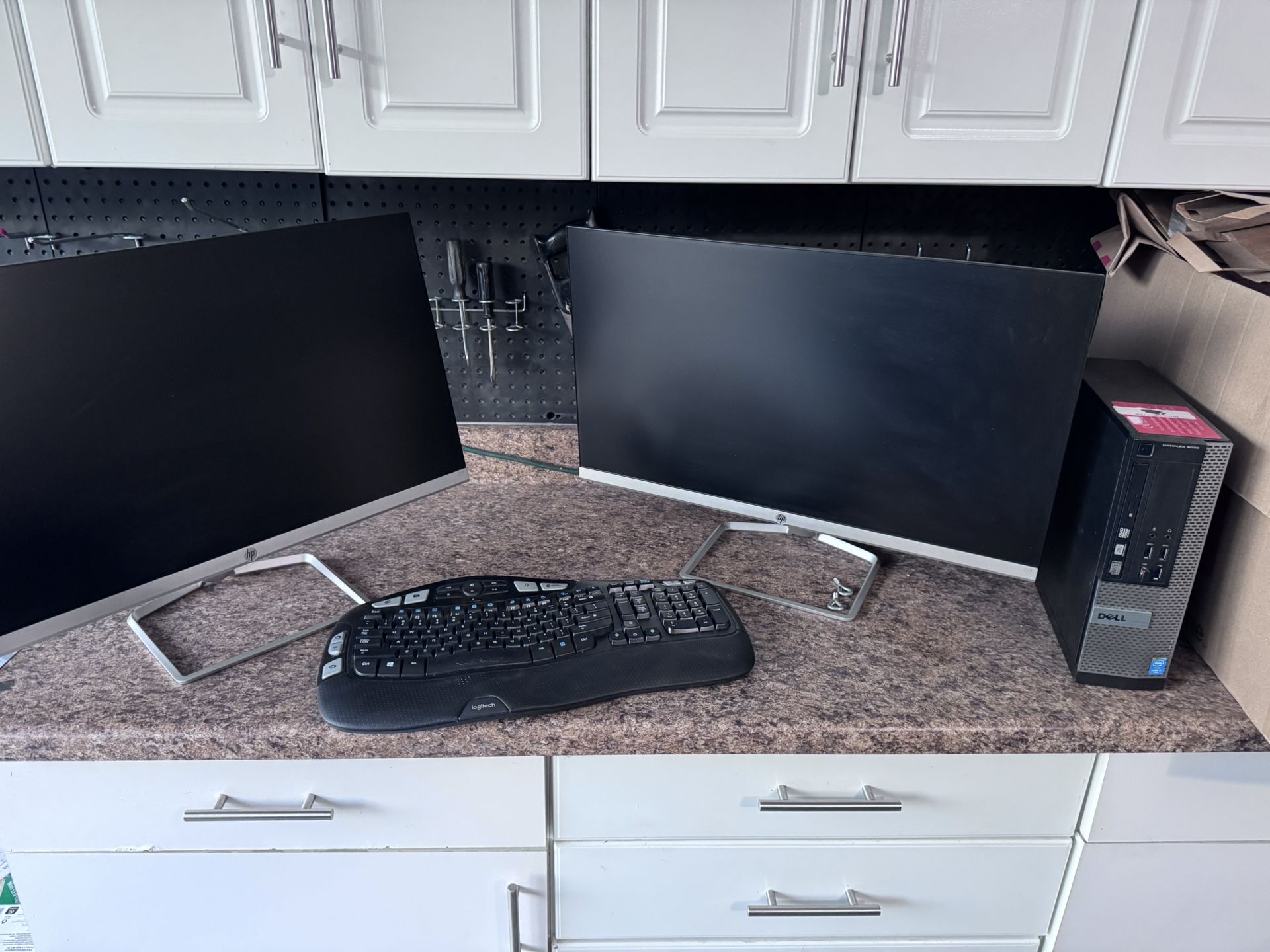 2 large computer monitors and a small desktop