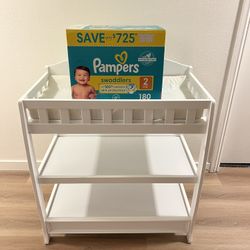 Baby Changing Table With a Box of Size 2 Pampers 