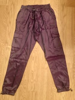 Unisex Lux joggers with adjustable support drawstrings at the waist and ankles.