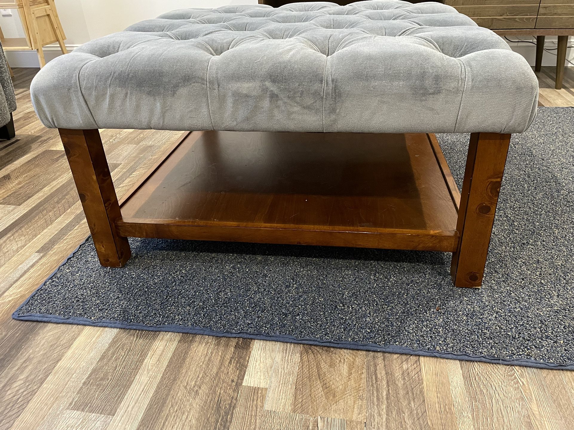 Gray Tufted Cloth And Wood Ottoman 