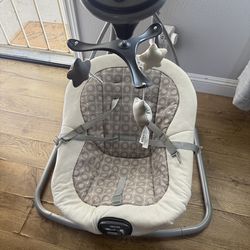 Gently used baby Graco swing