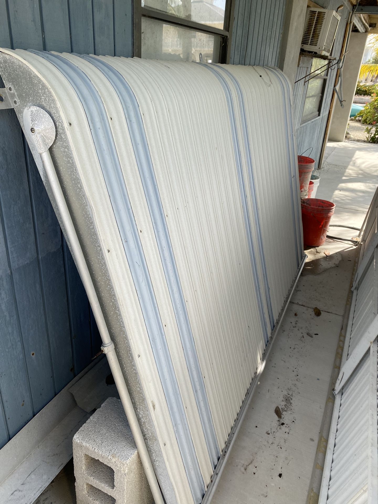 CLAM SHELL AWNINGS & BAHAMA HURRICANE SHUTTERS