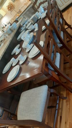 Large wood dining room table and 6 chairs