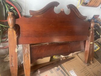 Old wooden bed frame and slats