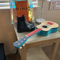 Kids Guitar . Lamp. Rain Boots . Pink Bag And Table 
