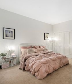 White Tufted Bed Frame with Mattress and Bedding
