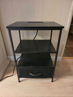 Small black table with charging station