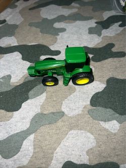 ERTL John Deere Plastic Tractor w/Metal Frame & Hitch, 3" Long #3594