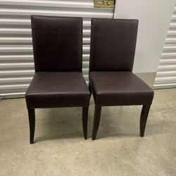 Eight dark brown chairs