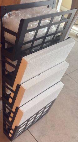 Metal tiered floor (black) magazine rack and mail/file organizer. $15 . (brand new)