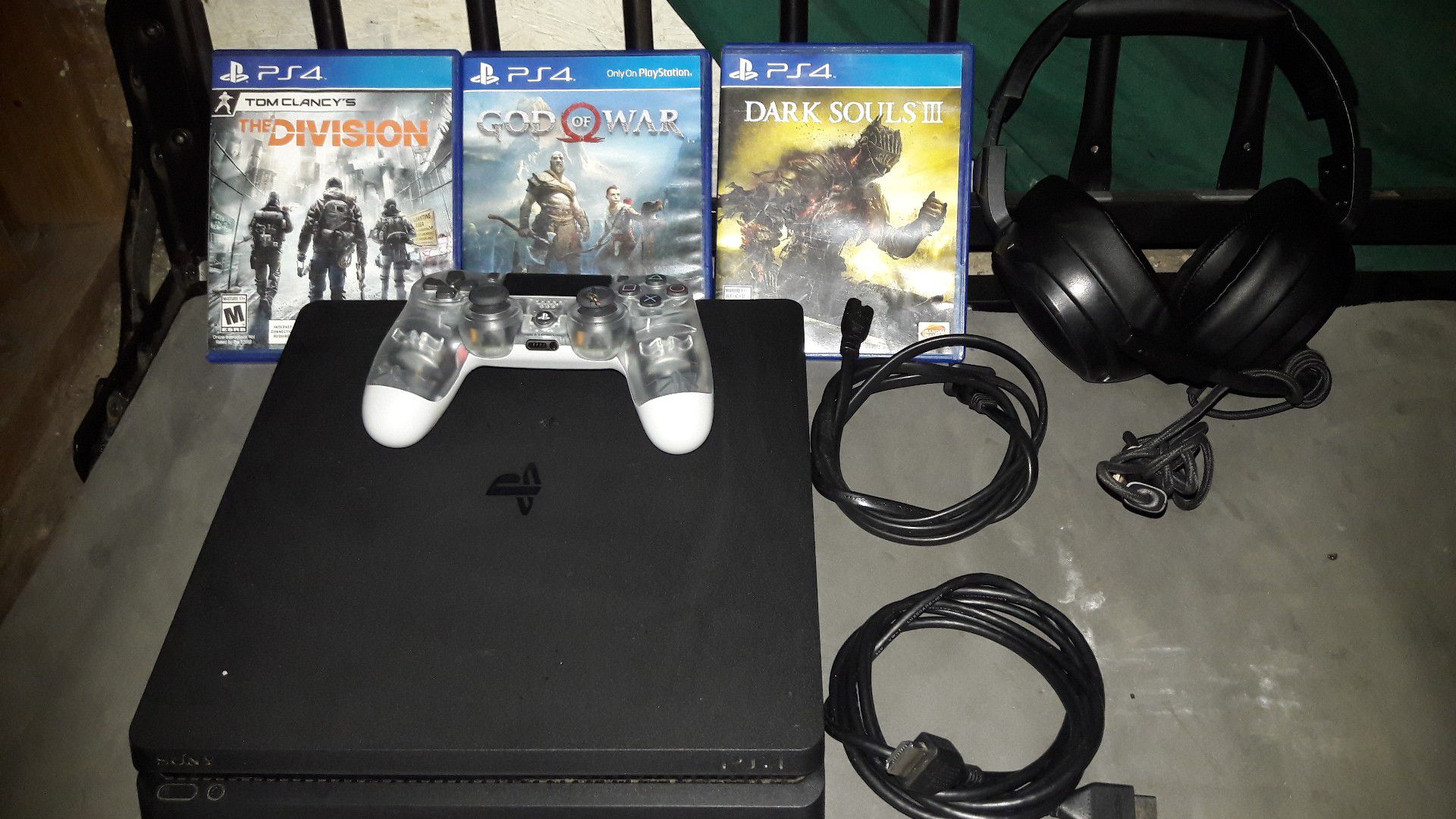 PlayStation 4 game console. With 3 games/ 1 controller/ and A pair of head phones.