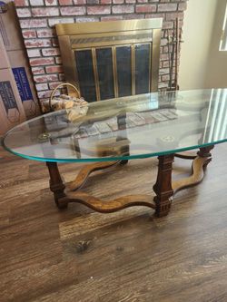 Ornate traditional glass-top coffee table