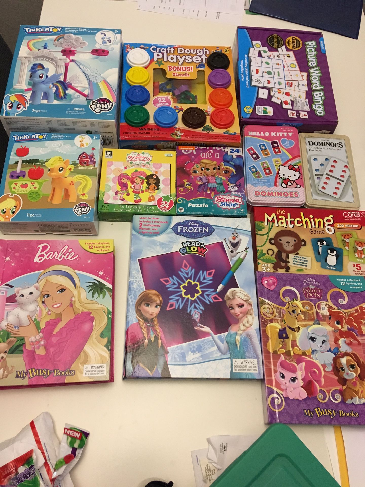 Puzzle books, games and play sets