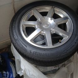 Three Cadillac Tires And Rims
