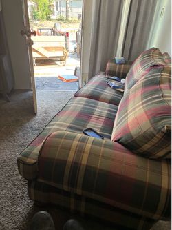 Plaid Couch Outside