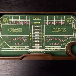 Vintage craps table with automatic dice roller