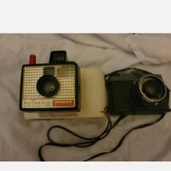 Vintage Polaroid Swinger Camera plus free camera