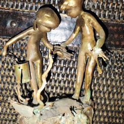 bronze original statue. very old. little boy little girl
