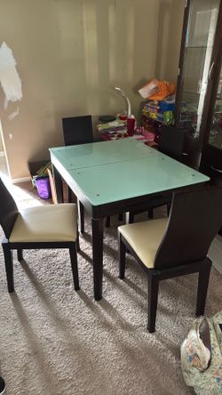 Glass top Table with leather chairs