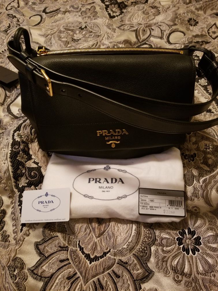 Prada purse, w/ plush bag, includes authentic card w/ original price tag.