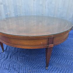 Glass-Top Round Coffee Table with Wicker Accents