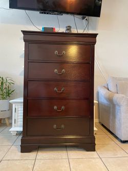 Solid wood, All the drawers work perfectly.
