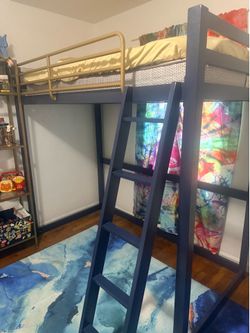 Black bunkbed with gold rails
