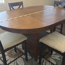 Wood dining table (with leaf) and chairs 4 9” round or 60” oval Counter height