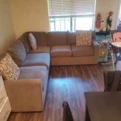 GREY L SHAPED COUCHES