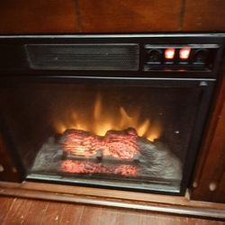 Electric fireplace also a heater works with heat or just flame or both.