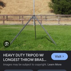 Tripod Sprinkler And Goodyear Red Hose