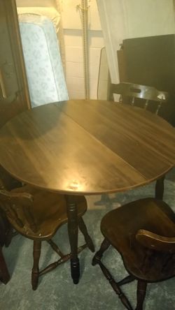 Wooden table with three chairs