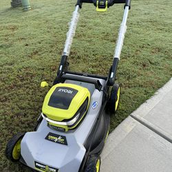 RYOBI electric 40-Volt HP Brushless 21 in. Cordless Battery Self-Propelled lawn Mower (READ AD)
