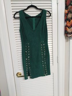 Hunter Green dress that laces up the sides and  is form fitting. Soft feeling almost like suede. Fashion House Brand Approximately a size 6-8
