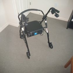 4 Wheel Walker With Seat. Brakes,and Storage