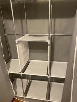 Closet Organizer, Has Poles For Hanging 