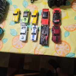 1/64th Scale Slot Car Track And Slot Cars With All Accessories And Then Some Their Are 42 Slot Cars And 12 Unopened Build Your Own Slot Cars.