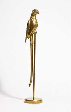 Mid-Century Hollywood Regency-style solid brass parrot figurine features a striking tall perch and finely detailed feathered textures