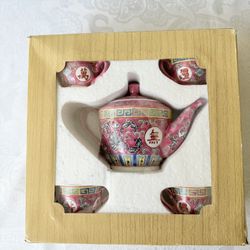 Vintage Chinese "Wan Shou Wu Jiang" tea set, characterized by its pink/red porcelain and the traditional "longevity without boundary" motif. Beautiful